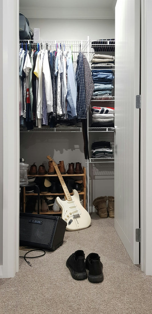 white electric guitar in closet