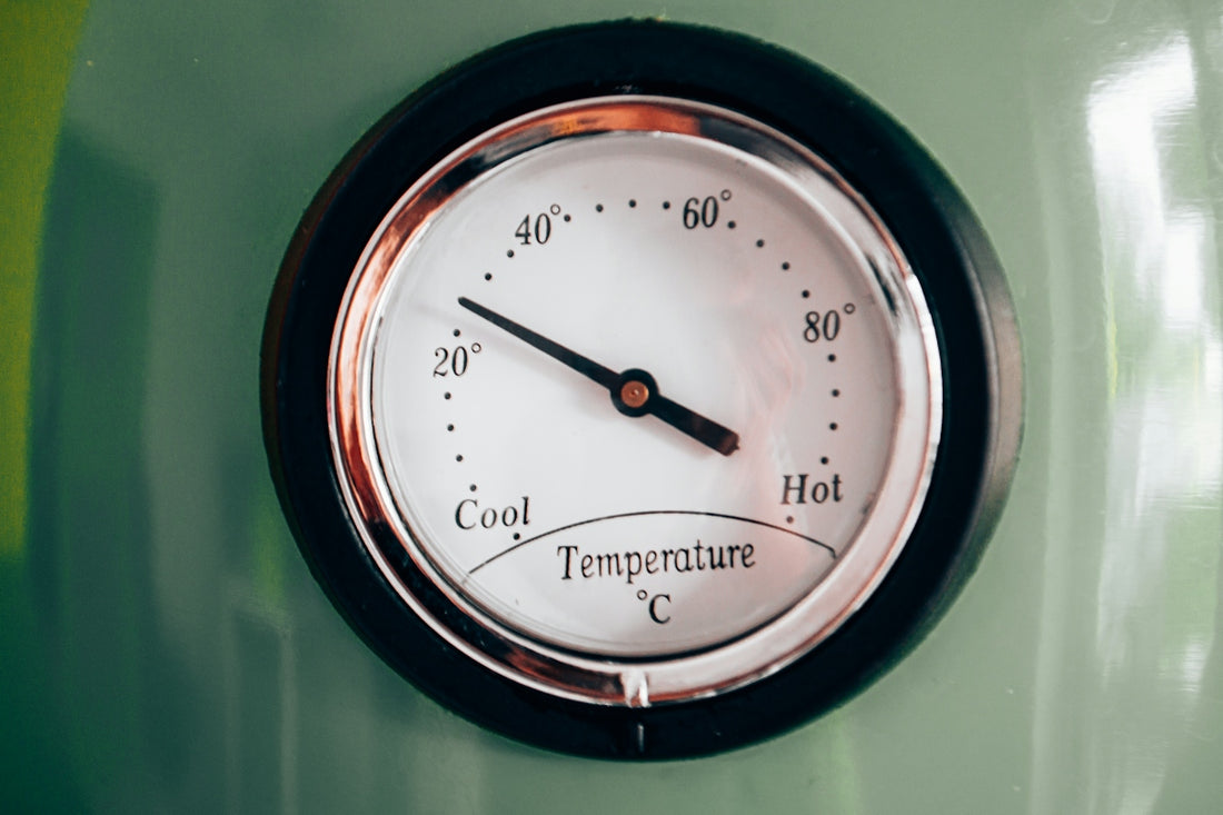 black and white analog clock at 10 00