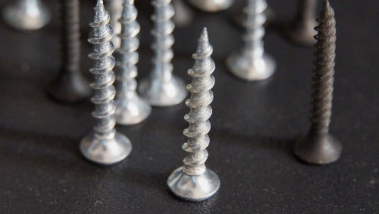 a bunch of screws that are on a table