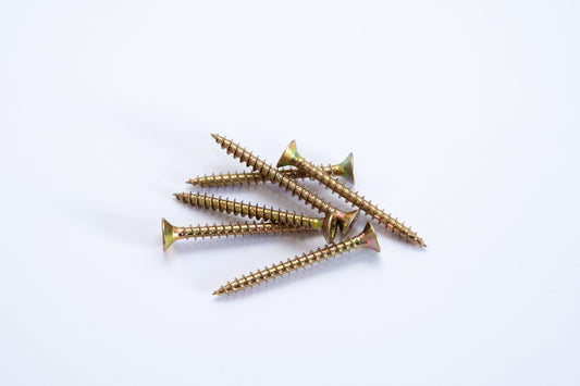 a group of screws on a white background