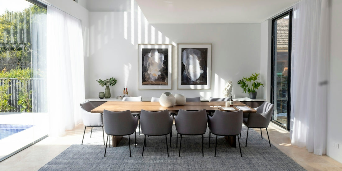 a dining room table with chairs around it