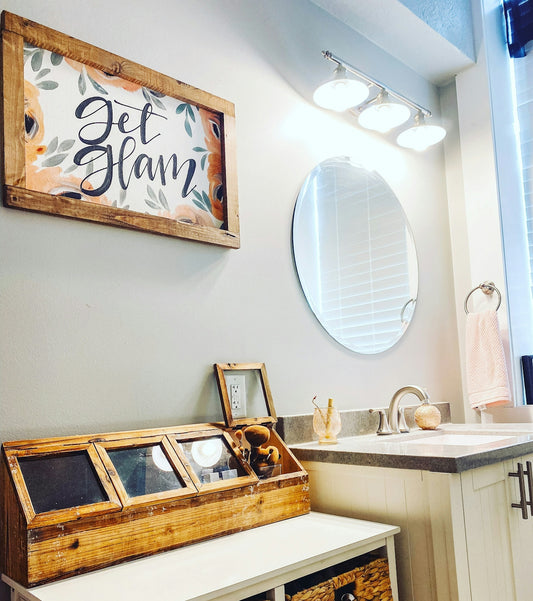 a bathroom with a mirror and a sink