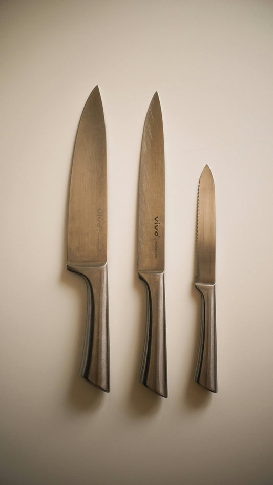 a couple of knives and a knife on a wall