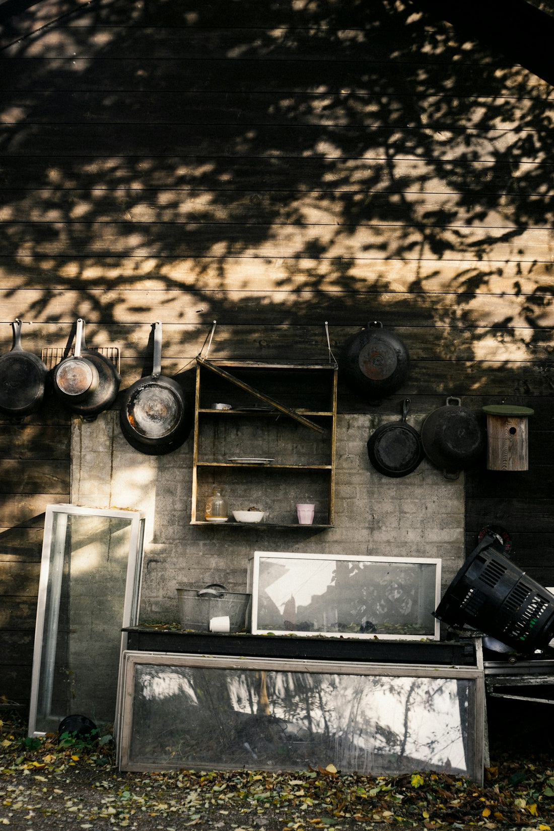 a kitchen with pots and pans hanging on the wall