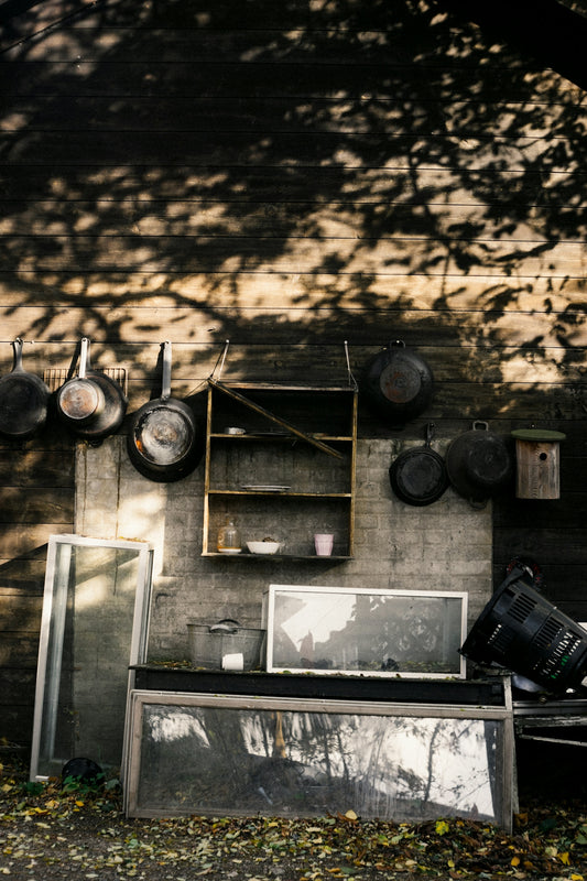 a kitchen with pots and pans hanging on the wall