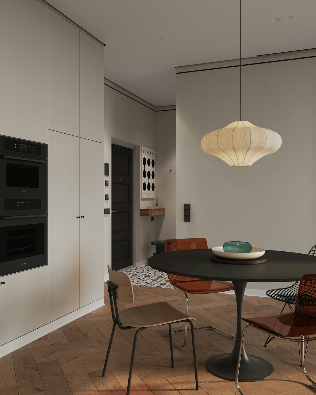 A dining room with a table and chairs