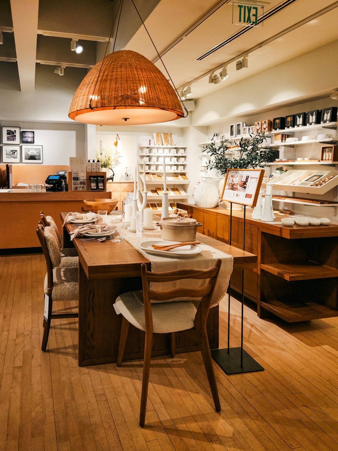 A dining room with a wooden table and chairs