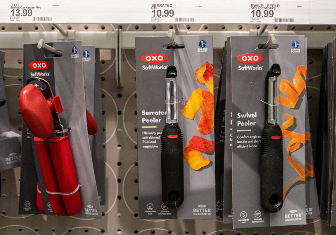 Kitchen tools are displayed on a store shelf.