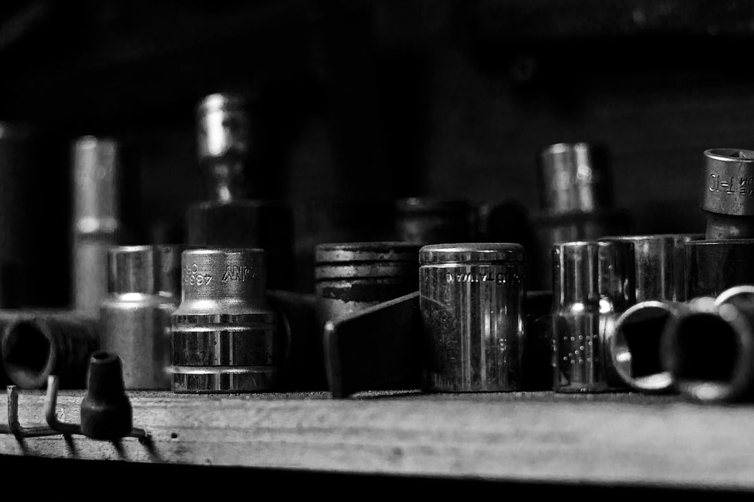 Various sockets are neatly organized on a shelf.