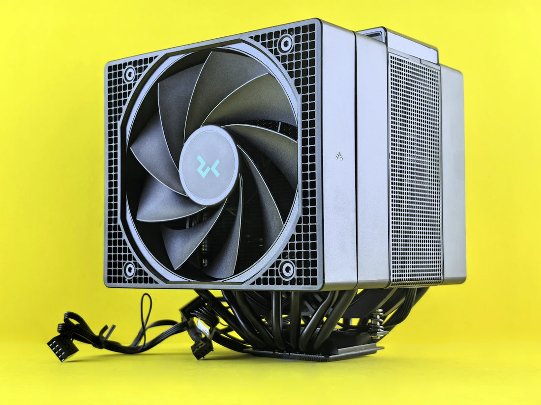A computer cpu cooler sits on a yellow surface
