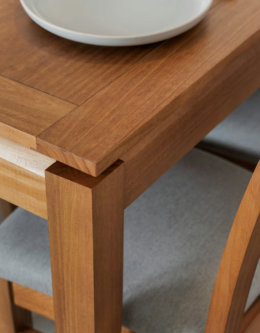 Wooden dining table with chairs and upholstered chairs