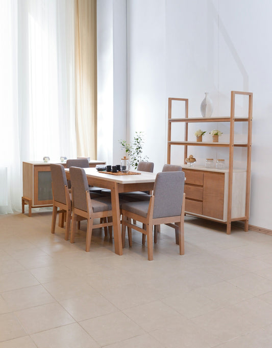 Dining table with chairs and wooden shelving unit.