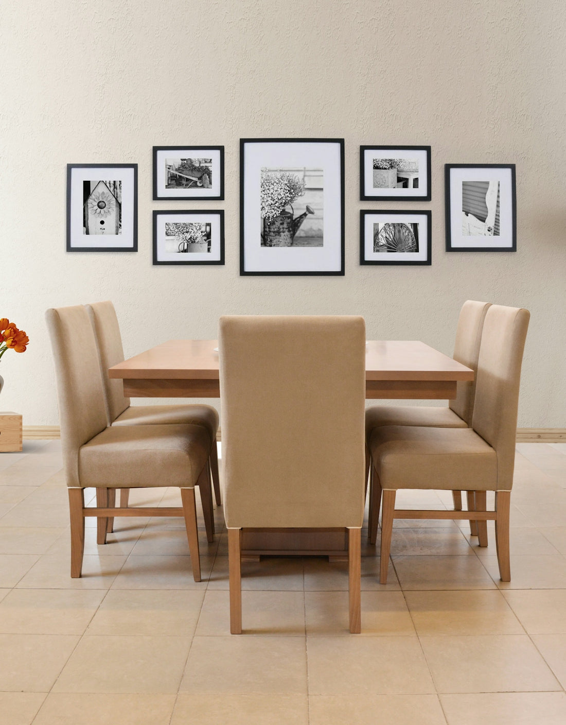 Dining table with chairs and framed artwork