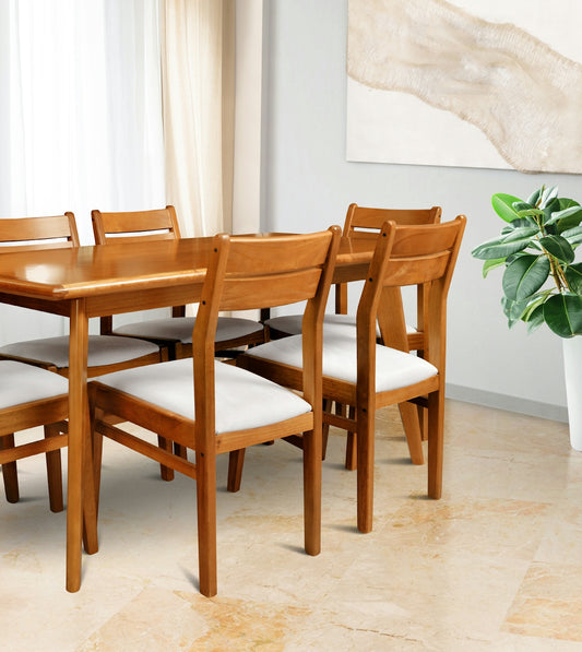 Wooden dining table with upholstered chairs