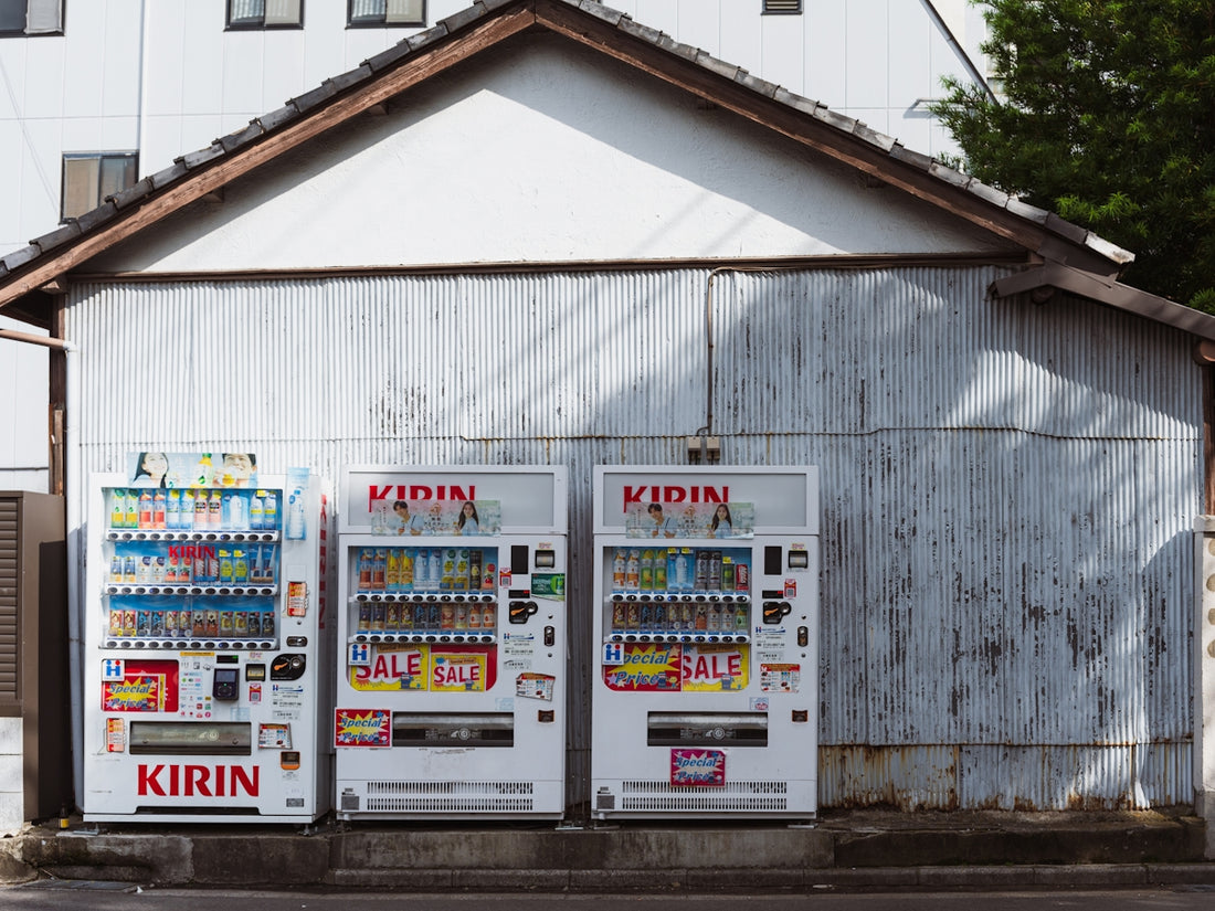 Three kirin brand vending machines in a row.