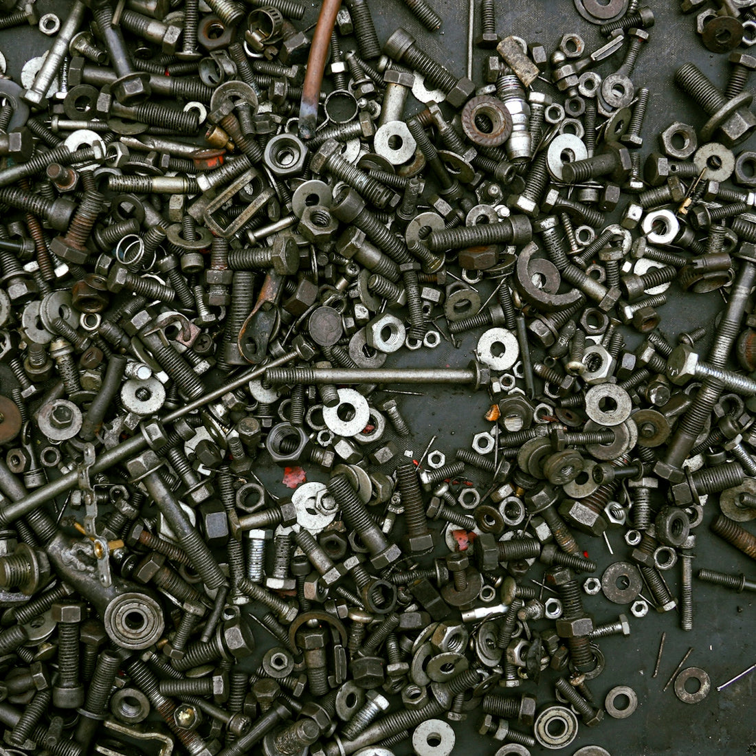 A pile of assorted nuts and bolts