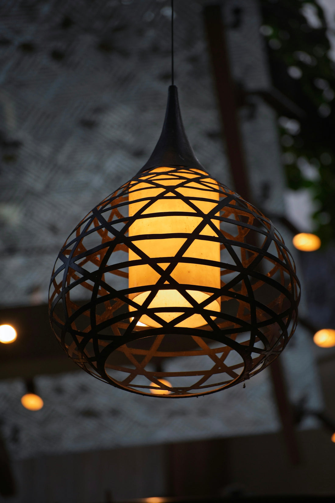 A decorative lantern with a warm glow hangs