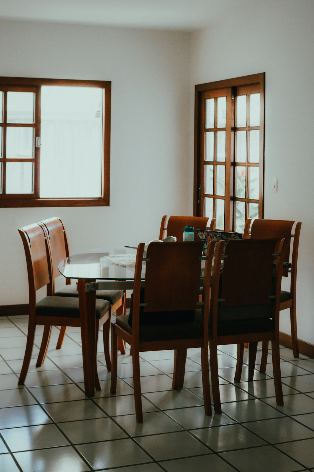 Dining table with six chairs in a room