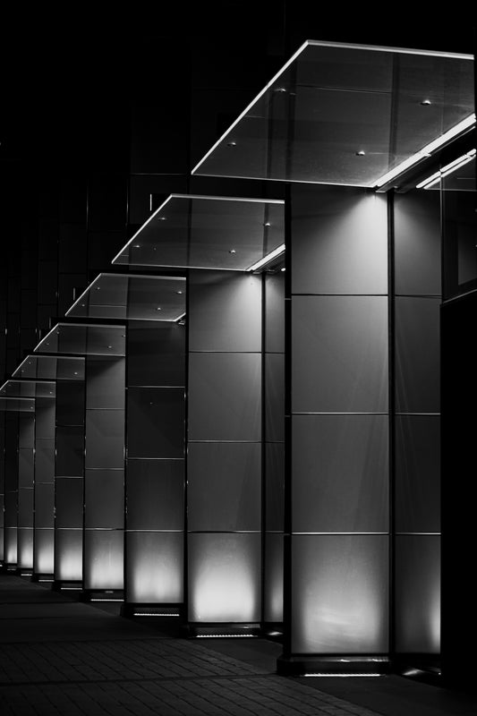 Modern architectural columns illuminated at night