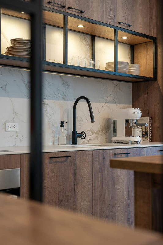 Modern kitchen with wood cabinets and marble backsplash