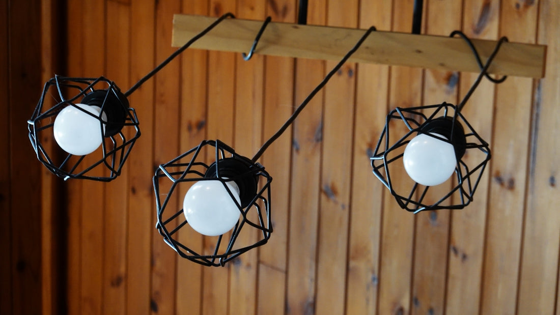 Three modern industrial pendant lights hanging