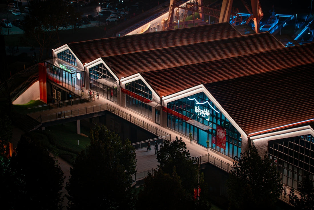 Modern building with illuminated roof at night