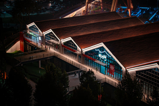 Modern building with illuminated roof at night
