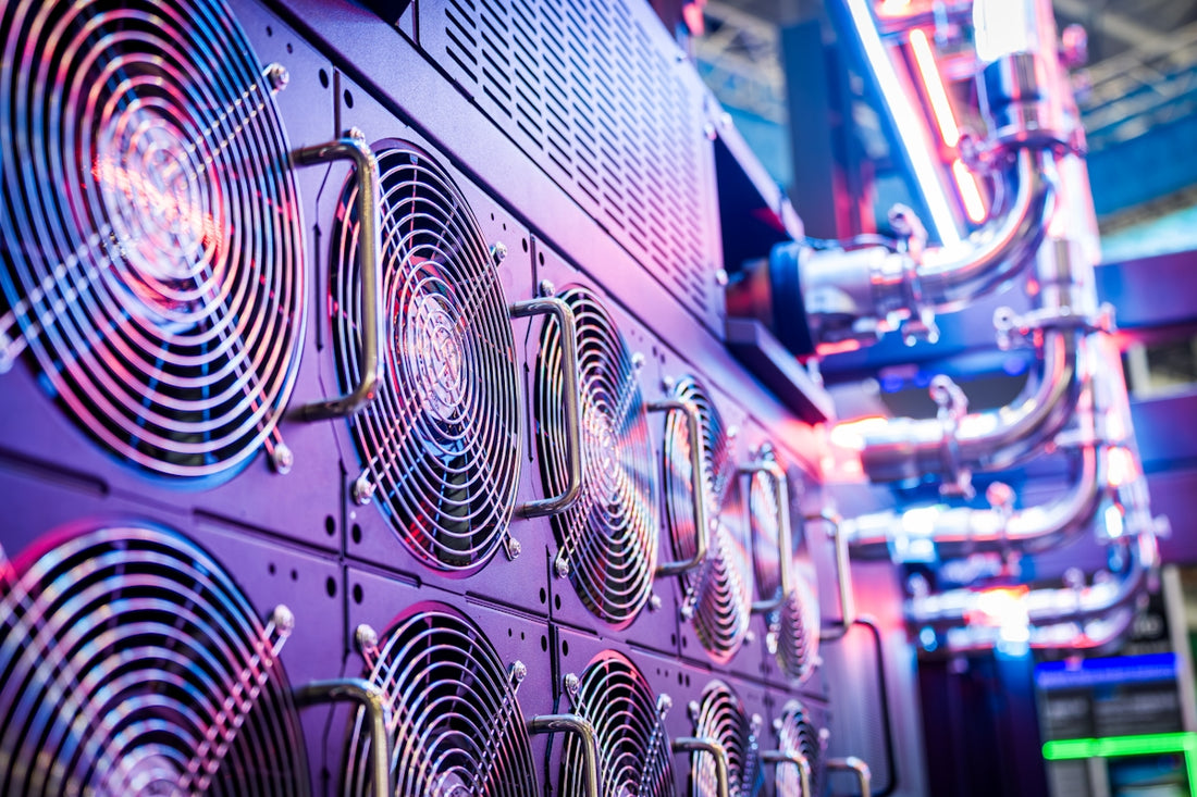 Close-up of server cooling fans in a vibrant data center.
