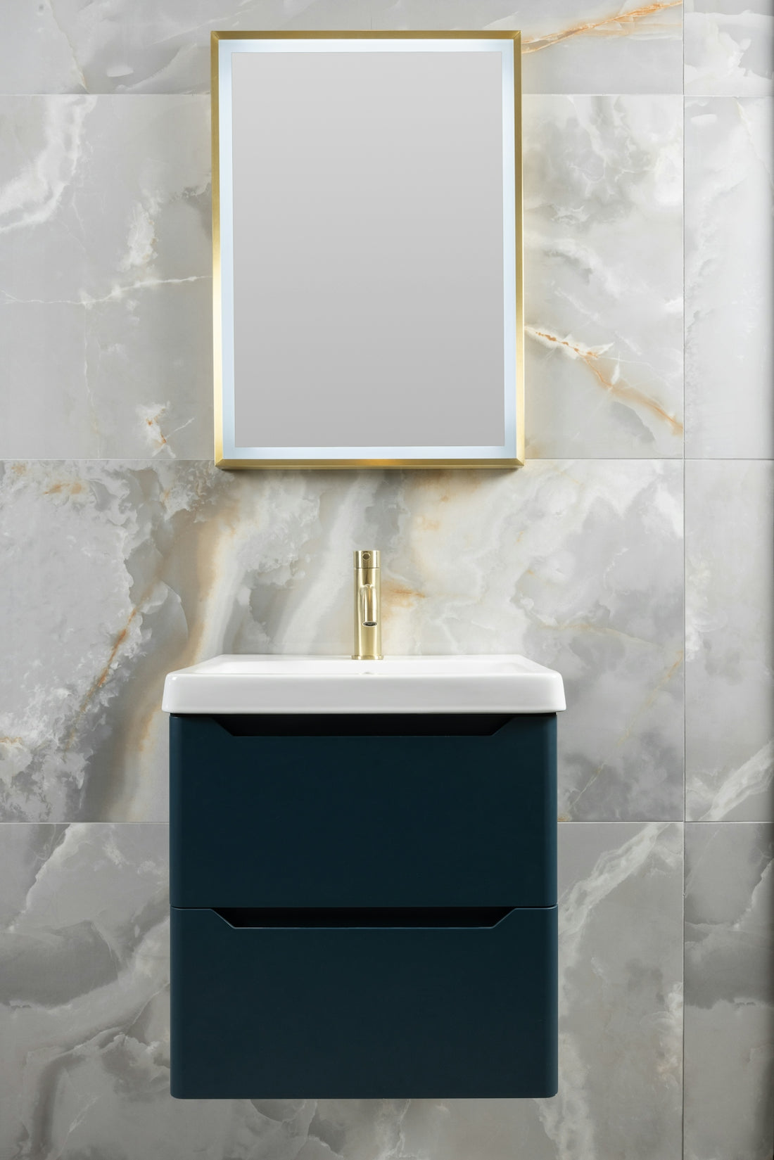 Modern bathroom vanity with gold accents and marble tile wall.