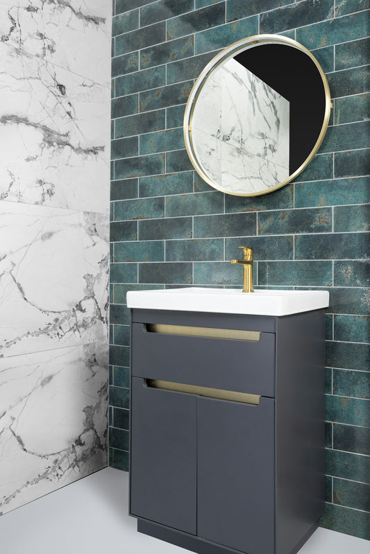 Modern bathroom vanity with sink, mirror, and tiled walls.