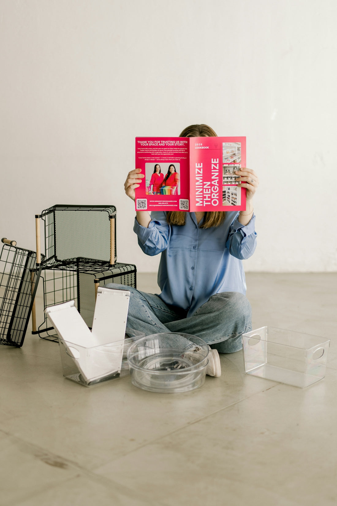Person holding minimize then organize booklet with storage items.