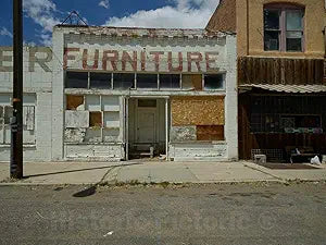 Photo - Perhaps The Furniture Sold at This Store in Shoshoni, Wyoming, did not sag. But The Sign Above The Door Does Now That The Store is Long-Closed- Fine Art Photo Reporduction 20in x 16in