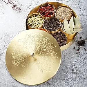 Ajuny Handcrafted Brass Spice Box 8 Inch Golden with Embossed Lid - Decorative Round Masala Canister 7 Removable Spice Storage Containers and 1 Designer Spoon Ideal for Seasonings & Herbs